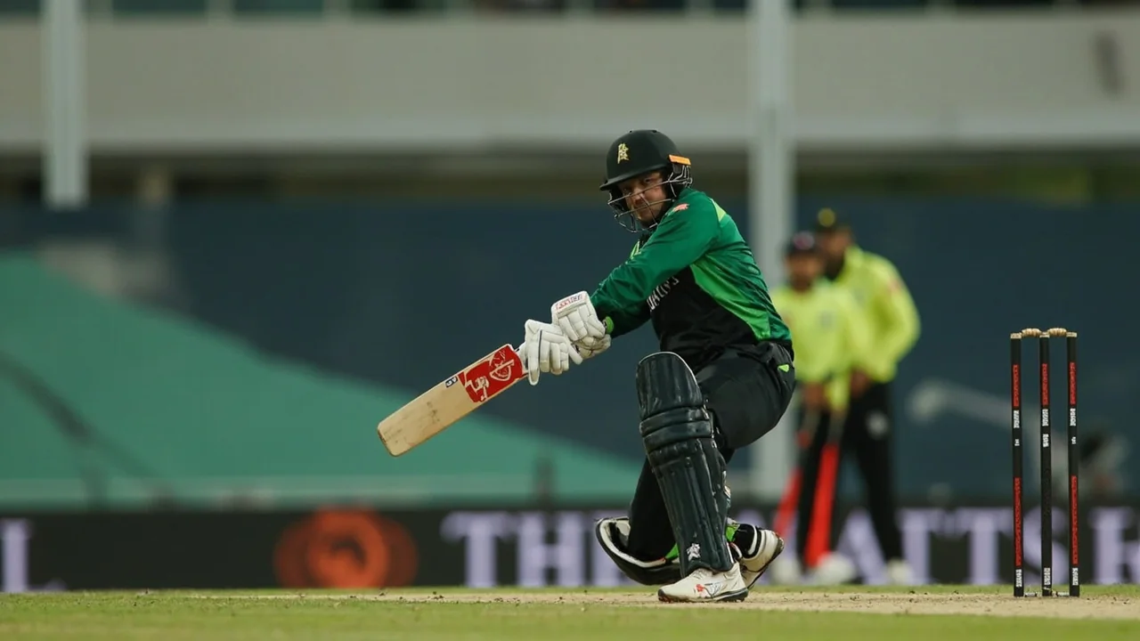 Medium view of a finger-spinner releasing the ball on a flat ODI deck with close-in fielders set and the batter waiting at the crease in the background